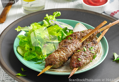 Image of grilled minced meat skewers kebabs