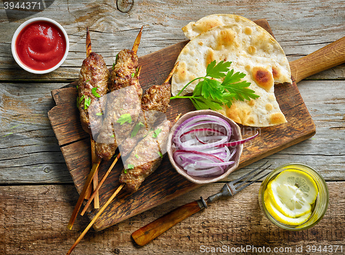 Image of grilled minced meat skewers kebabs