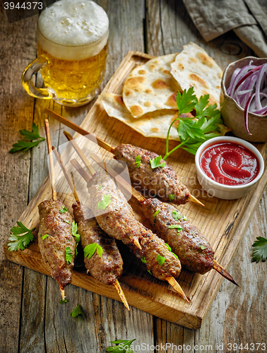 Image of grilled minced meat skewers kebabs