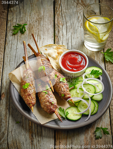 Image of grilled minced meat skewers kebabs