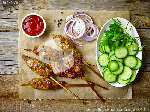 Image of grilled minced meat skewers kebabs