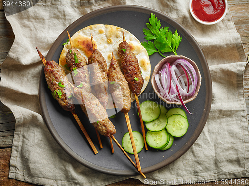 Image of grilled minced meat skewers kebabs