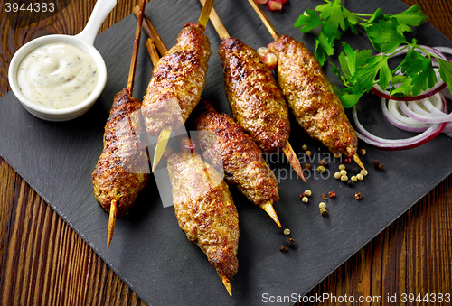 Image of grilled minced meat skewers kebabs