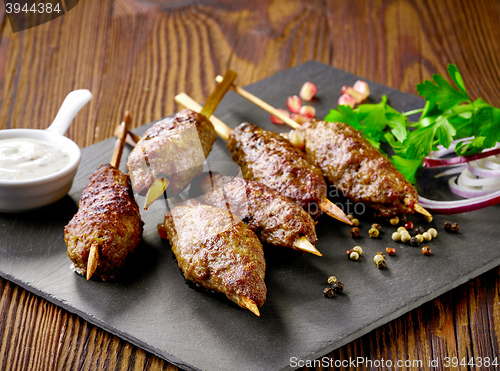 Image of grilled minced meat skewers kebabs