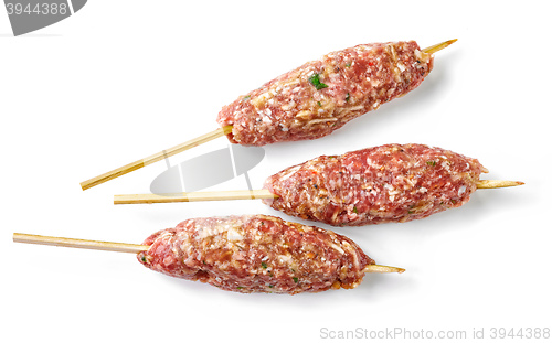 Image of raw minced meat skewers kebabs