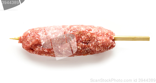 Image of raw minced meat skewer kebab