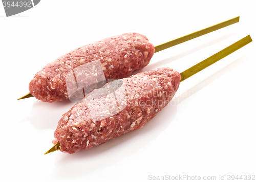 Image of fresh raw minced meat skewers kebabs