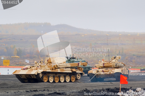 Image of Armoured recovery vehicle BREM-1M evacuates tank