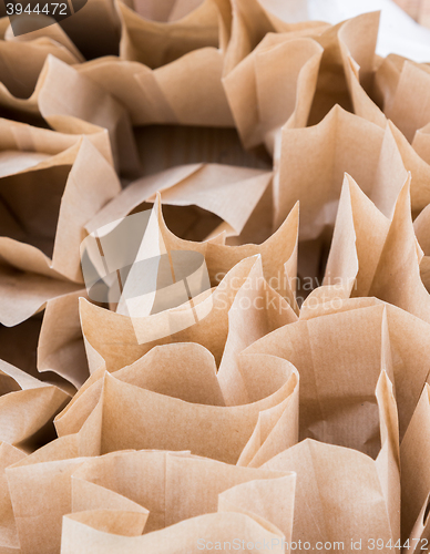 Image of Brown paper disposable bags in the pile