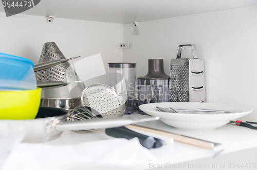 Image of Various tableware on shelf in the kitchen