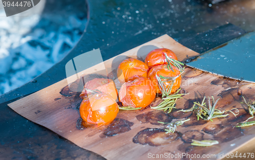 Image of tomatoes on the grill pan  the table