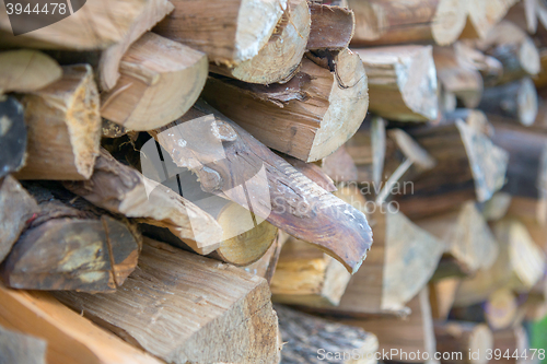 Image of dry chopped firewood logs in a pile