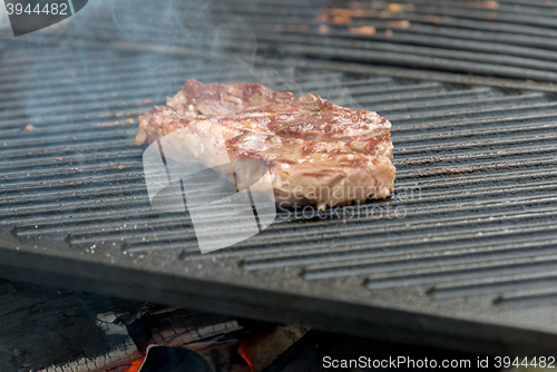Image of beef steaks on the grill