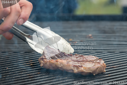 Image of beef steaks on the grill