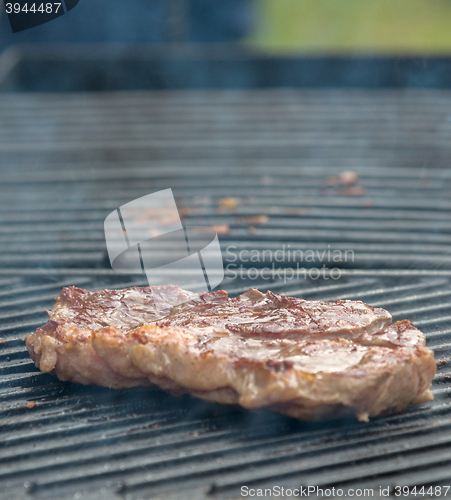 Image of beef steaks on the grill