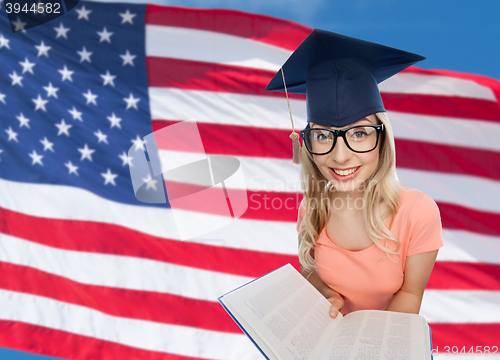 Image of student woman in mortarboard with encyclopedia