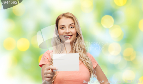 Image of happy woman or teen girl with blank white paper