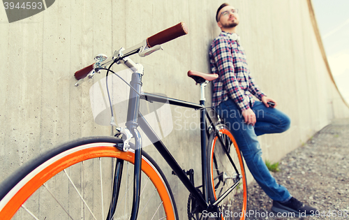 Image of close up of hipster fixed gear bike and man