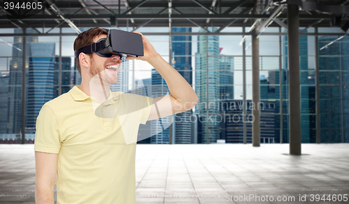 Image of happy man in virtual reality headset or 3d glasses