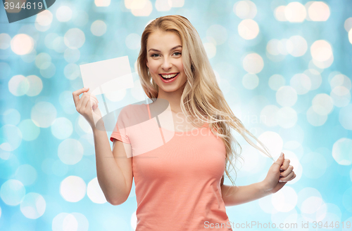 Image of happy woman or teen girl with blank white paper