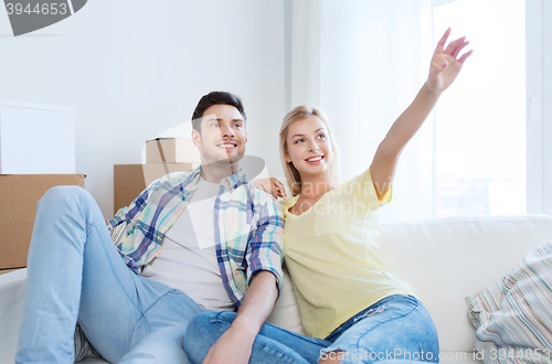 Image of couple with boxes moving to new home and dreaming