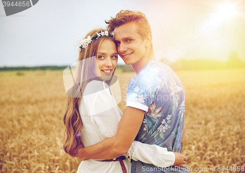 Image of happy smiling young hippie couple outdoors