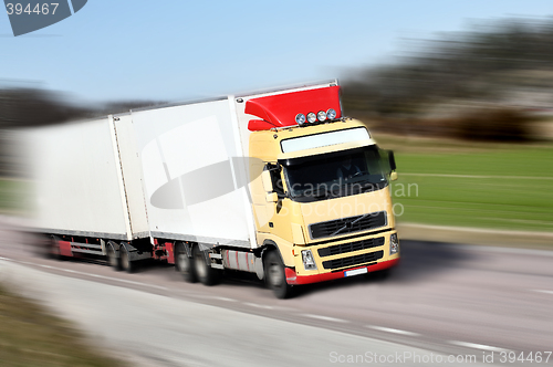 Image of truck driving on country-road/motion