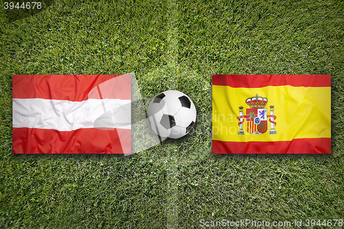 Image of Austria vs. Spain flags on soccer field
