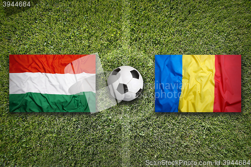 Image of Hungary vs. Romania flags on soccer field