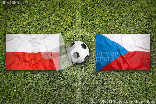 Image of Poland vs. Czech Republic flags on soccer field