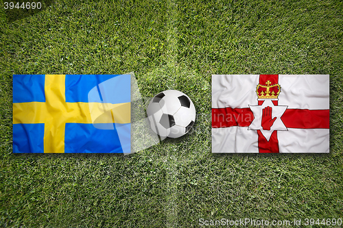 Image of Sweden vs. Northern Ireland flags on soccer field