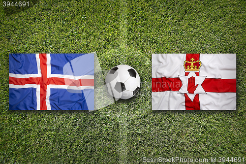 Image of Iceland vs. Northern Ireland flags on soccer field