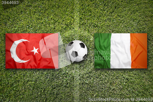 Image of Turkey vs. Ireland flags on soccer field