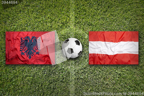 Image of Albania vs. Austria flags on soccer field