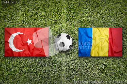 Image of Turkey vs. Romania flags on soccer field