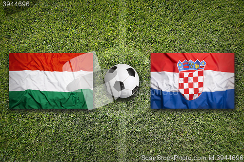 Image of Hungary vs. Croatia flags on soccer field