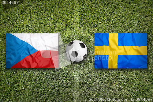 Image of Czech Republic vs. Sweden flags on soccer field