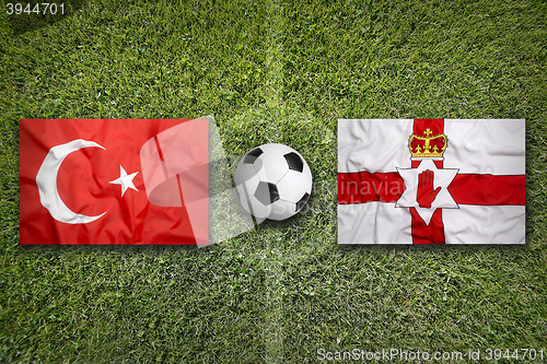 Image of Turkey vs. Northern Ireland flags on soccer field