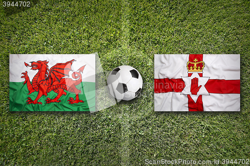 Image of Wales vs. Northern Ireland flags on soccer field