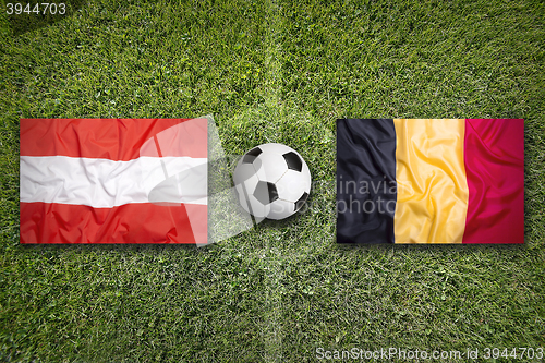 Image of Austria vs. Belgium flags on soccer field