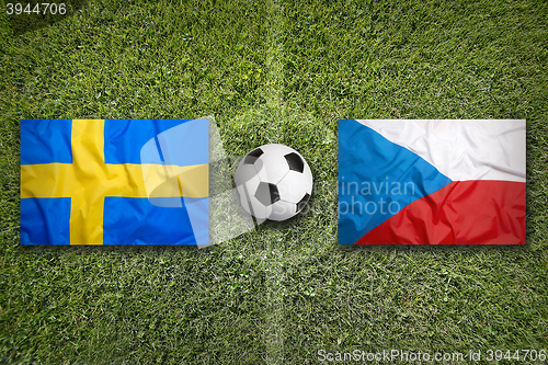 Image of Sweden vs. Czech Republic flags on soccer field