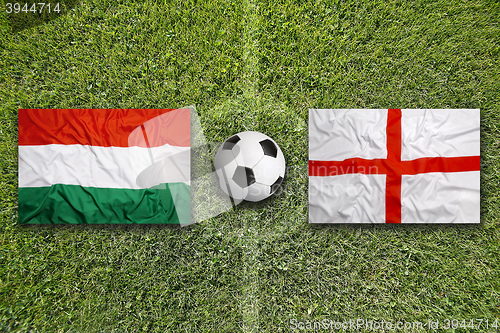 Image of Hungary vs. England flags on soccer field