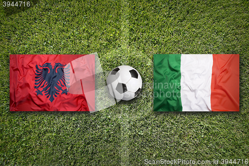 Image of Albania vs. Italy flags on soccer field