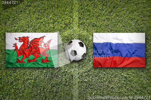 Image of Wales vs. Russia flags on soccer field