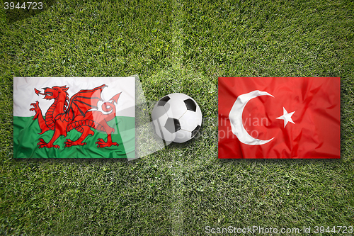 Image of Wales vs. Turkey flags on soccer field