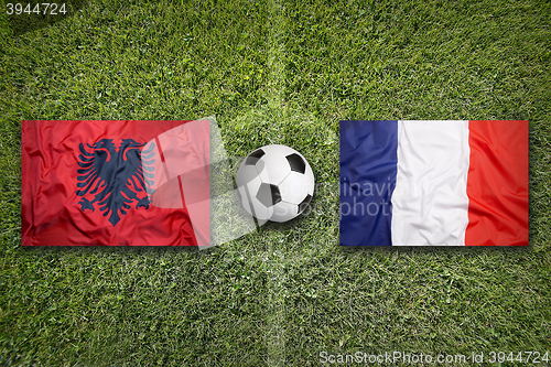 Image of Albania vs. France flags on soccer field