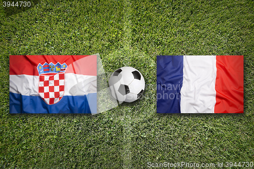 Image of Croatia vs. France flags on soccer field