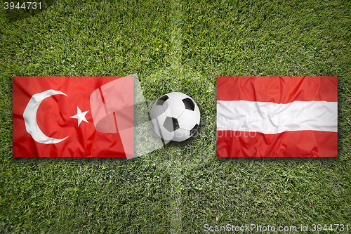 Image of Turkey vs. Austria flags on soccer field