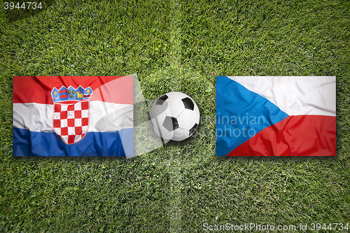 Image of Croatia vs. Czech Republic flags on soccer field