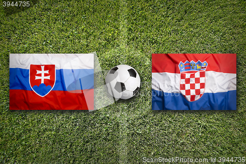 Image of Slovakia vs. Croatia flags on soccer field